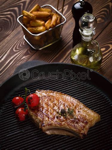 Roasted Pork Steak On Ribs Stock Photo Crushpixel