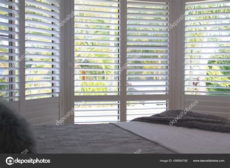 Luxury White Indoor Plantation Shutters Bedroom Selective Focus Stock Photo by ©Anett1964 498684768