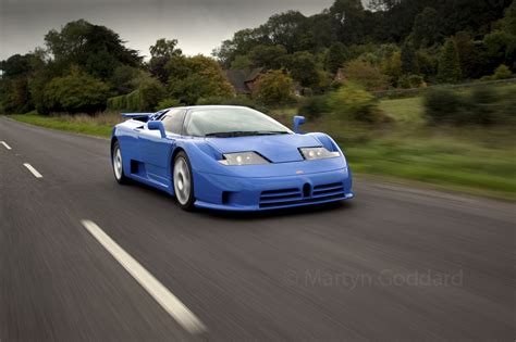 Bugatti EB110 SS driving at speed on a country road in Hampshire UK ...