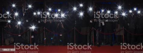 Paparazzi Using Flash Photography Along Red Carpet Stock Photo