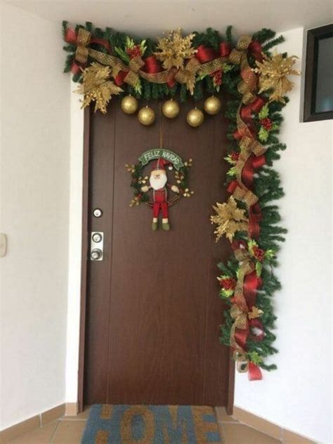 A Door Decorated With Christmas Wreaths And Decorations