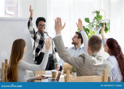 Diverse Business People Group Raise Hands At Corporate Presentation