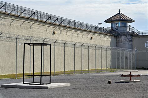 A jail cell with a cross on the ground photo – Free Kingston Image on