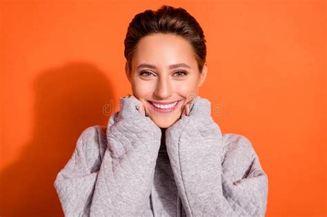 Photo Of Dreamy Shiny Young Lady Wear Grey Sweatshirt Smiling Arms