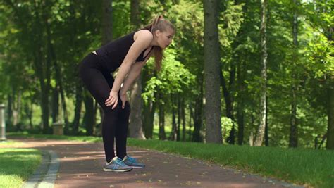 Woman Breathing After Run Marathon Outdoor Tired Female Runner After Running In Park Fitness