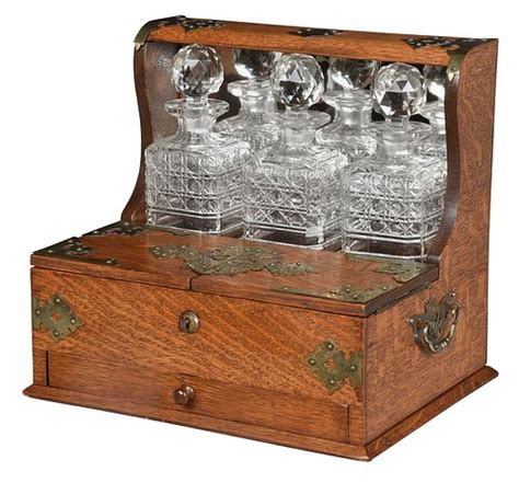 Oak Mirror Back Tantalus With Three Cut Glass Decanters Sold At Auction On 14th September