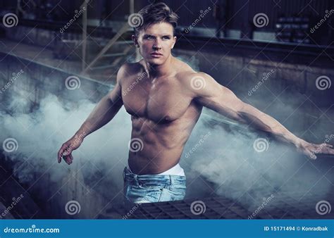 Handsome Bodybuilder Man Showing Thumbs Up Sign With A Naked Torso Royalty Free Stock Photo