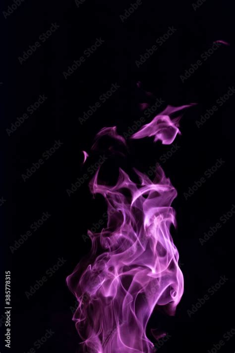 Close Up Vertical Picture Of An Isolated Bright Purple Flame With