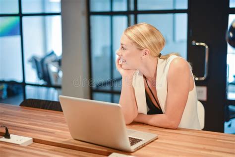 Business Blonde Girl Using A Laptop In An Office Stock Photo Image Of Corporate Internet