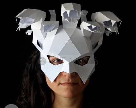 A Woman Wearing A Paper Mask With Birds On It