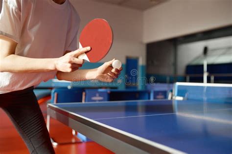 Closeup View Of Adult Woman Playing Table Tennis In Gym Stock Photo