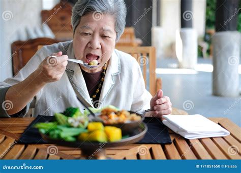 Old Elderly Senior Elder Woman Eating Food Mature Retirement Lifestyle