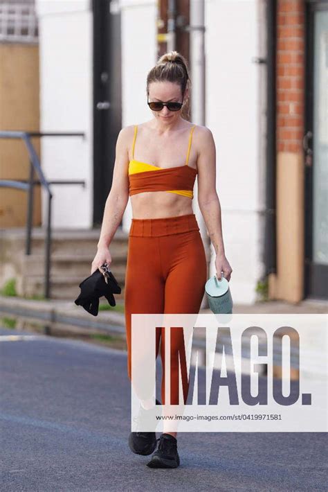 Olivia Wilde Shows Off Her Abs In A Red And Yellow Workout Ensemble As