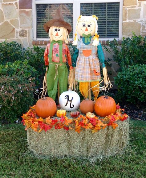 Stacy's 2015 Fall yard decorations. I used a boy and girl scarecrow, a ...