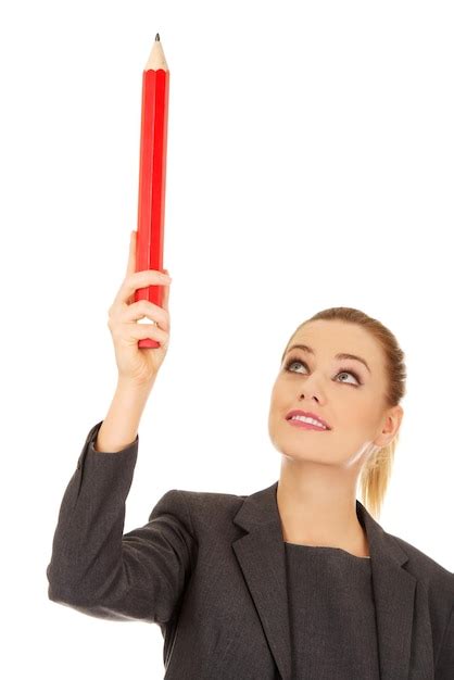 Premium Photo Businesswoman Holding Large Red Pencil Against White