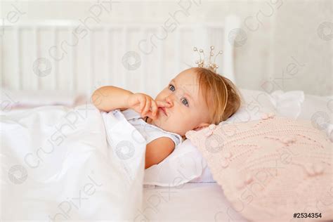 Little girl sleeping in the bed in the bedroom with - stock photo 2534354 | Crushpixel