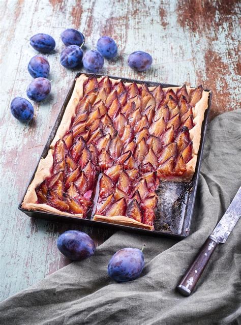 Traditional German Zwetschgenkuchen with Sliced Plums on a Rustic ...