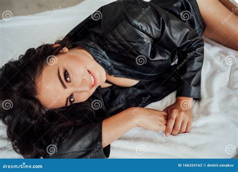Girl In Black Lingerie Is Lying On A White Bed Stock Photo Image Of Body Glance