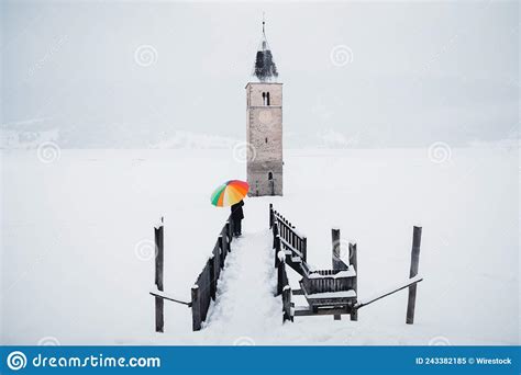 Beautiful Shot of the Tower in the Middle of the Lake Reschen during Winter in South Tyrol ...