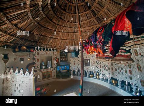 Interior of bhunga circular house with household utilities placed at ...