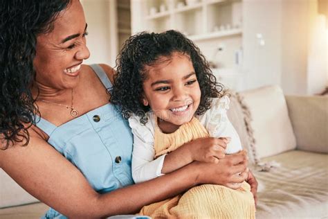 Happy Hug And Laughing With Mother And Daughter On Sofa For Bonding