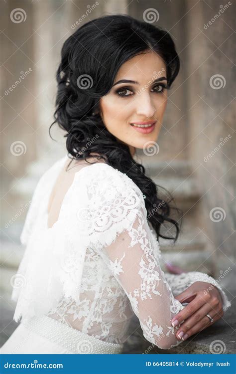 Beautiful Innocent Brunette Bride In White Dress Posing Near Church Wall Stock Photo Image Of