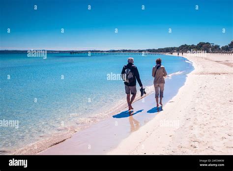 Happy Romantic Middle Aged Couple Enjoying Beautiful Sunset Walk On The