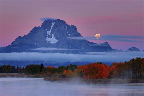 Moonset during sunrise at Mount Moran during autumn Photograph by ...