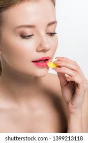 Attractive Nude Woman Holding Yellow Jelly Stock Photo 1399213118