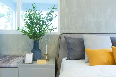 Stylish Modern Bedroom Interior. Green, Yellow and Blue Pillow on Comfortable Bed. Stock Photo ...