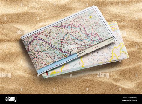 Road map on sand background in closeup Stock Photo - Alamy