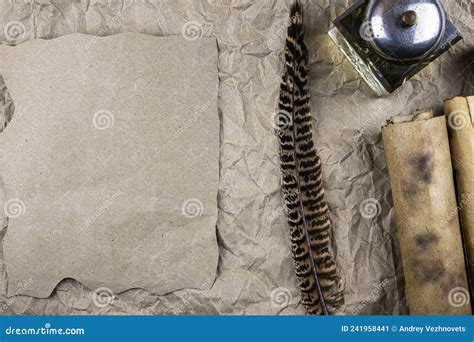 Sheet Of Paper An Inkwell And A Quill Old Scrolls On A Background Of