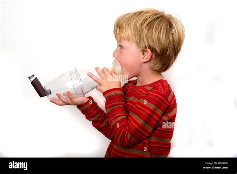 Boy Using Asthma Inhaler With Spacer Device Stock Photo Alamy