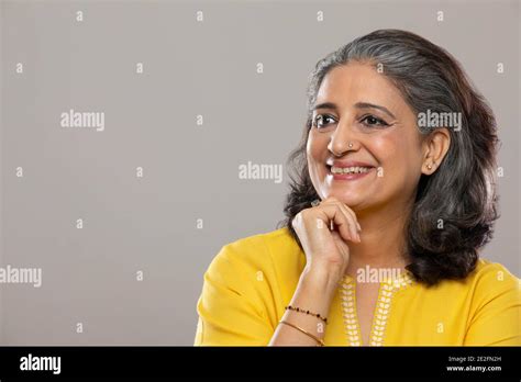 Senior Adult Woman Posing In Front Of Camera Stock Photo Alamy