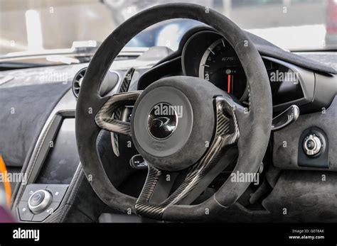 Steering wheel and dashboard of a McLaren 675LT hypercar Stock Photo ...