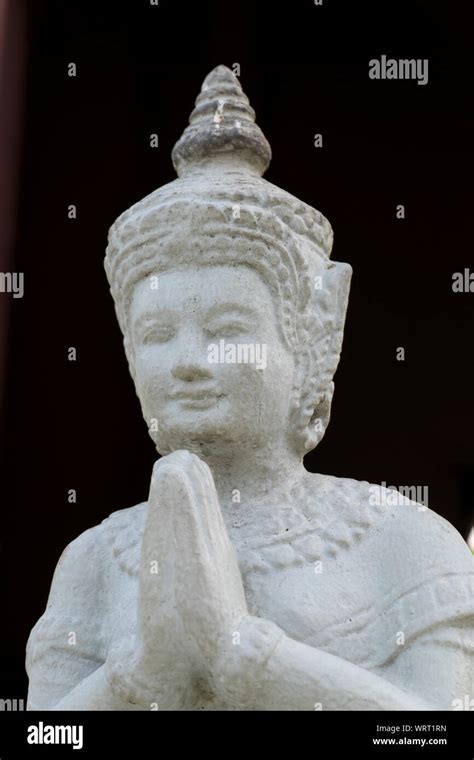 A Semi Abstract Image Of A Praying Buddha White Figure With No