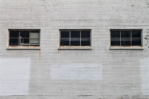 Free Stock Photo of 3 Windows on White Brick Building