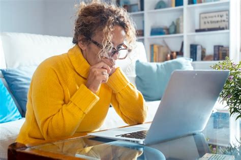 Premium Photo Side View Concentrated Pleasant Mature Adult Woman Looking At Computer Screen