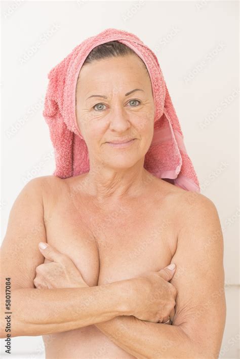 Naked Mature Woman With Hands On Breasts Stock Photo Adobe Stock