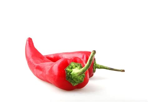 Premium Photo Close Up Of Red Chili Peppers Against White Background