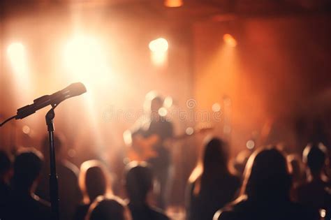 Dynamic And Energetic Concert Stage With Vibrant Lights And Blurred