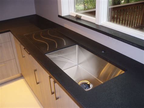 Black Concrete Countertop With Custom Sloped Drainpan And Inlaid Stainless Steel Pieces