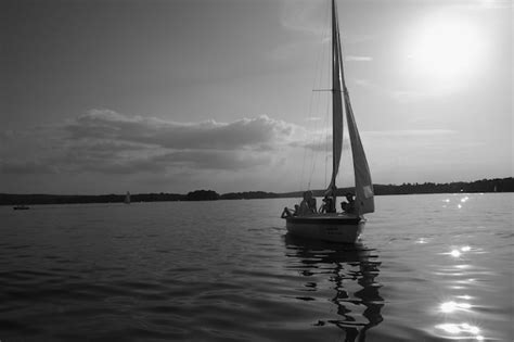 Premium Photo | Sailboat in sea at sunset