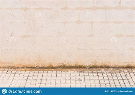 Old Grunge White Plaster Stone Wall Background Texture With Sidewalk