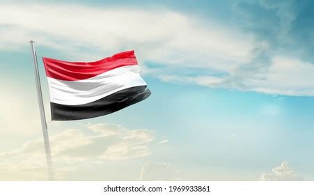 Yemen National Flag Waving Beautiful Sky Stock Photo