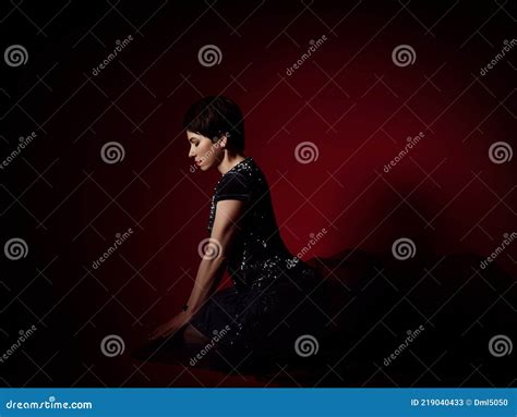 Thoughtful Sad Romantic Short Haired Brunette Woman In Black Dress