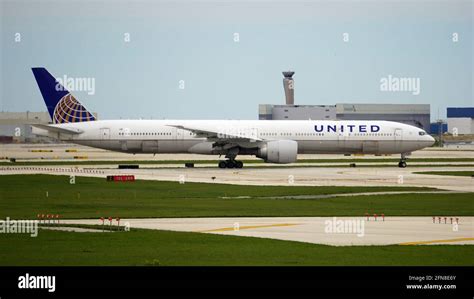 United Airlines Boeing 777 300 Taxis Down The Runway After Landing At