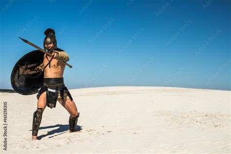 Screaming ancient Roman warrior with spear and shield Stock Photo | Adobe Stock