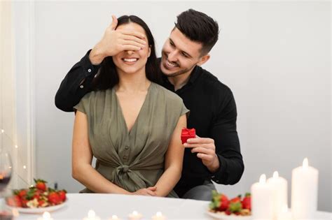 Premium Photo Loving Man Surprising His Girlfriend With Valentine Present