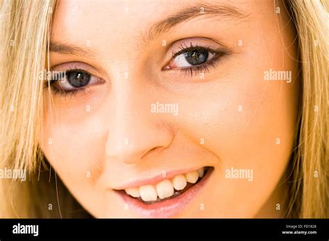 Close Up Of Face Of Very Pretty Year Old Blonde Girl With Blue